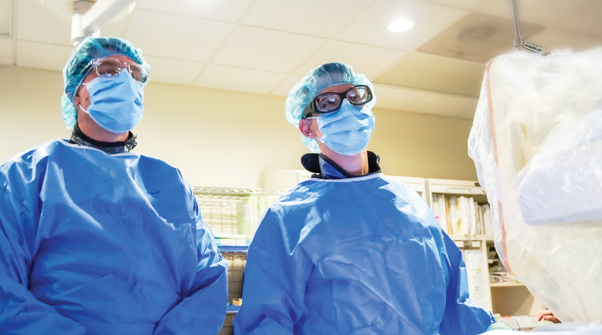 doctors looking at a screen behind the camera